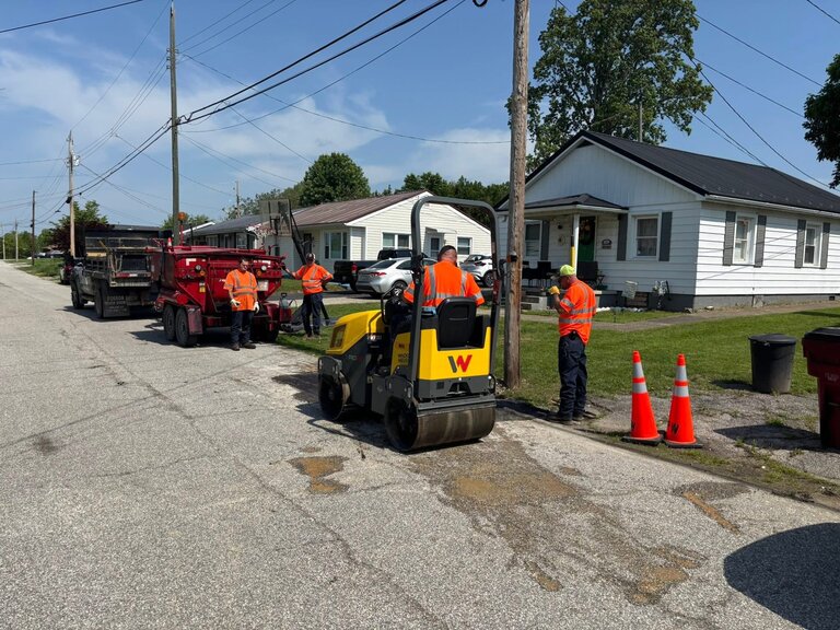 Road workers fixing a road